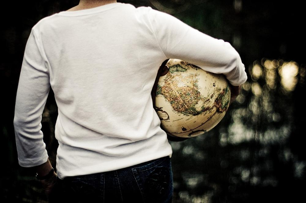 Traveler with a globe